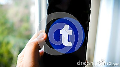 Tumblr app on smartphone hand Editorial Stock Photo