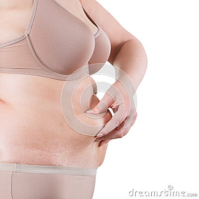 Tummy tuck, flabby skin on a fat belly, plastic surgery concept Stock Photo