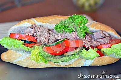 Tuna Baguette With Vegetables On The Brown Plate Stock Photo