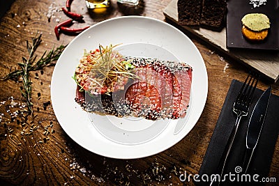 Tuna sashimi on white plate. Delicious healthy Japan traditional snacks seafood closeup served on a table for lunch in Stock Photo
