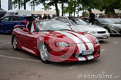 tuned second-generation Mazda MX-5 (Miata) NB. It is red with white lines Editorial Stock Photo