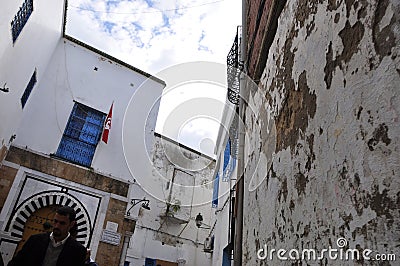 Tunesia: A man walking through the Medina in Tunis-City Editorial Stock Photo