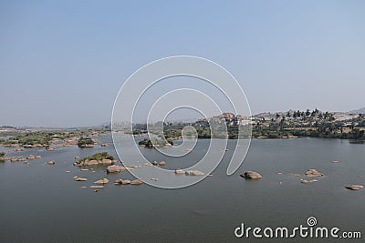 Tungabhadra River - flowing through Hampi, Karnataka - India tourism - Heritage - blue landscape Stock Photo