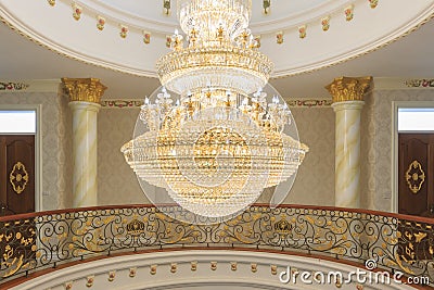 A tungsten bulb crystal chandelier. Stock Photo