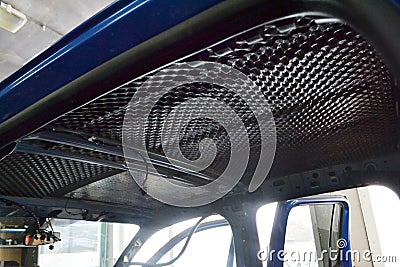 Tuning the car in a pickup truck body with three layers of noise insulation Stock Photo