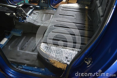 Tuning the car in a pickup truck body with three layers of noise insulation Stock Photo