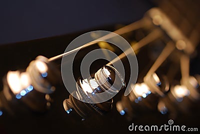 Tuning Pegs of A Bass Guitar Stock Photo