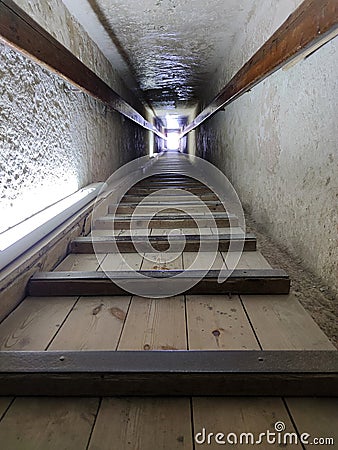 Tunnel entrance to the ancient Egyptian pyramid. A long passage in the pyramid of Giza. A prehistoric landmark. Giza, Cairo, Egypt Editorial Stock Photo