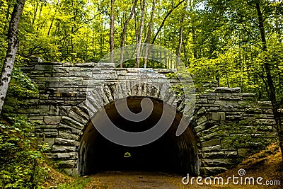 Tunnel to road to nowhere at lakeshore trailhead near lake fonta Stock Photo