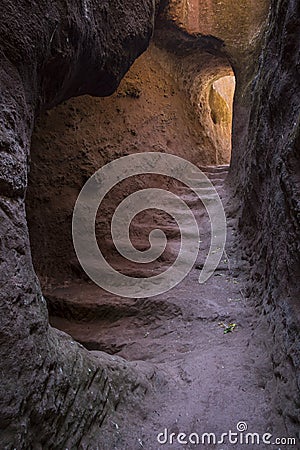 Tunnel under rock hewn church Stock Photo