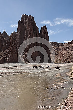 Unidentified men riding horses in the beautiful Quebrada Seca y El Duende Canyon, near Tupiza - Bolivia, South America Editorial Stock Photo