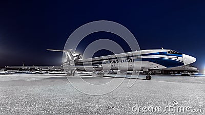 Tupolev Tu-154m Alrolsa Airlines parked at the airport at night Editorial Stock Photo