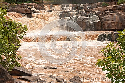 Turbid water of tropical waterfall after hard rain Stock Photo
