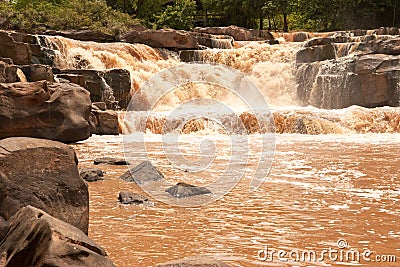 Turbid water of tropical waterfall after hard rain Stock Photo