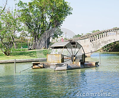 Turbine Rotating Water Bridge and Tree Stock Photo