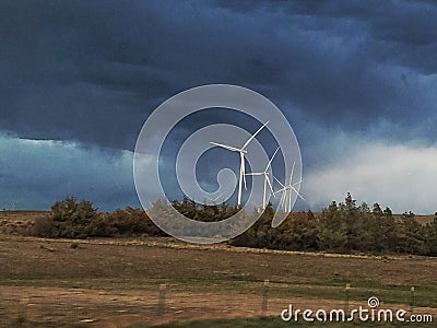 Turbines against Thunder Storm Stock Photo