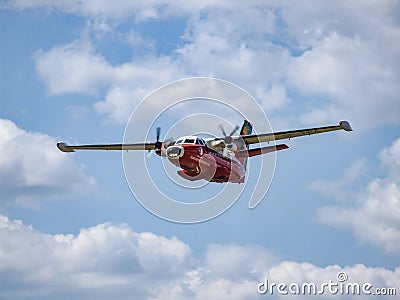 Turbolet L-410 Parrot aircraft during low pass. Editorial Stock Photo