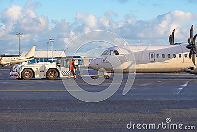 Turboprop aircraft towing airport, engine start preparation Stock Photo