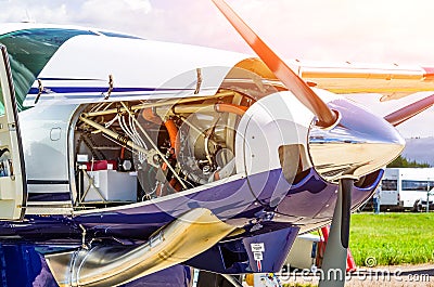 Turboprop airplane aircraft a propeller chrome luster with open bonnet repair, engine check. Stock Photo