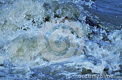 Turbulent water causing froth Stock Photo