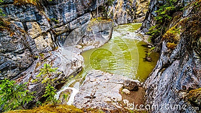 The turbulent waters of the Maligne Canyon flowing through the deep Maligne Canyon in Jasper National Park Stock Photo