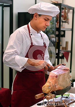 Turin, Piedmont/Italy - 10/22/2010- The Food Fair `Salone del Gusto`. Pork butcher cuts row ham. Editorial Stock Photo