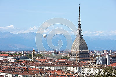 Turin skyline view, Mole Antonelliana tower and hot air balloon in a sunny day in Italy Stock Photo