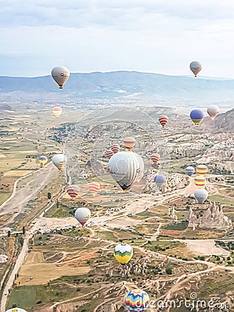Turkey Cappadocia 14.06.2022 Launching process. Colored balloons in Cappadocia in mountains early morning at sunrise Editorial Stock Photo