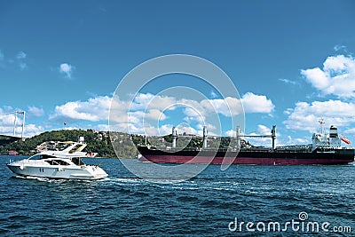 Turkey, Istanbul, Bosphorus Channel, Bosphorus Bridge, an cargo ship under the Bridge. Gate, nautical Editorial Stock Photo
