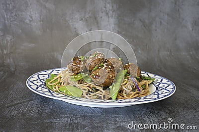 Serving Turkey Quinoa Meatballs with Soba Noodles Stock Photo