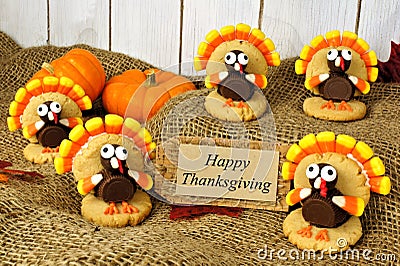 Turkey shaped cookies with Happy Thanksgiving card on burlap Stock Photo