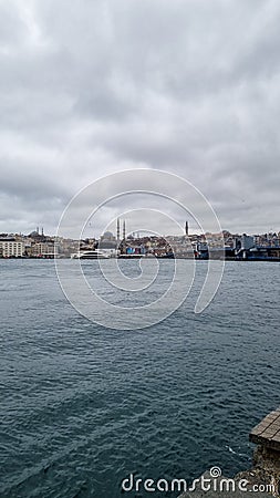 Turkey. Tourist boat sails on the Golden Horn in summer. Beautiful sunny view of the Istanbul waterfront with a mosque Stock Photo