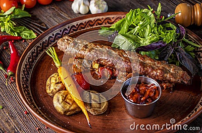 Turkish and Arabic Traditional Ramadan mix kebab plate, Kebab lamb and beef with baked vegetables, mushrooms and tomato sauce, Stock Photo