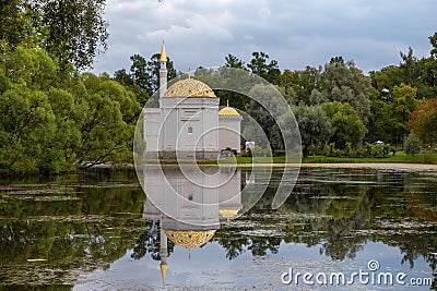Turkish Bath Pavilion reflected in the water of The Great Pond. Catherine Park in Tsarskoe Selo, Saint Petersburg Stock Photo