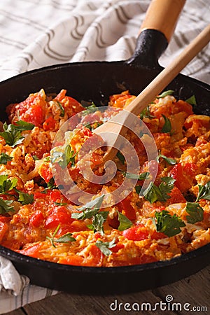 Turkish breakfast Menemen in a pan close-up vertical Stock Photo