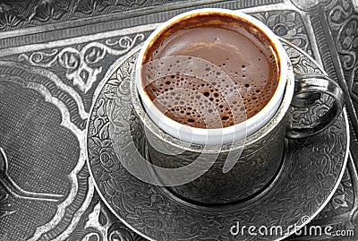 Turkish coffee with traditional embossed metal cup and tray Stock Photo