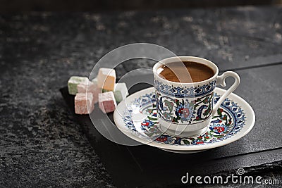 Turkish Coffee with traditional porcelain cup. Coffee with Turkish delight. Stock Photo