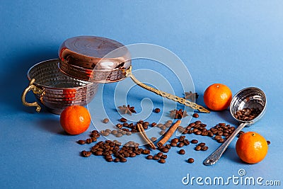 Turkish copper dishes with coffee beans and tangerines Stock Photo