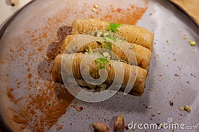 Turkish dessert baklava with pistachio on the table. Stock Photo