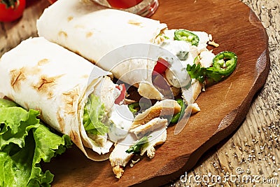 Turkish doner kebab, shawarma, roll with meat and pita bread on Stock Photo