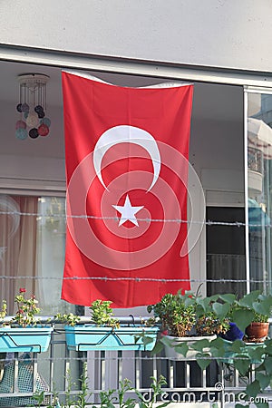 Turkish flag on the balcony of a residential building, Turkey, August 2022. Stock Photo