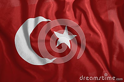 The Turkish flag is flying in the wind. Colorful, national flag of Turkey. Patriotism, a patriotic symbol Stock Photo