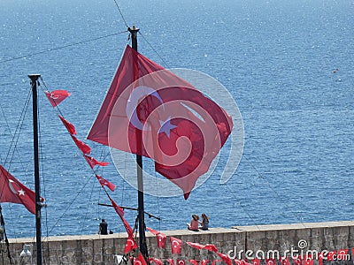 Turkish Flag pirate ship sea water harbour beach bar resturant old town Antalya turkey Editorial Stock Photo