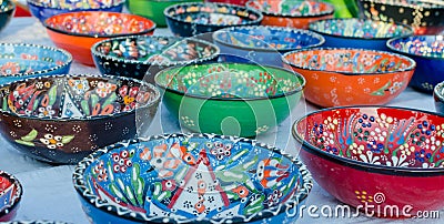 Turkish handmade colourful ceramic plates and bowls. Close up Stock Photo