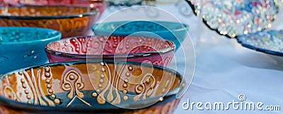 Turkish handmade colourful ceramic plates and bowls. Close up Stock Photo