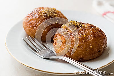 Turkish Kemalpasa Cheese Dessert / Lor Tatlisi with Pistachio Powder and Sherbet Stock Photo