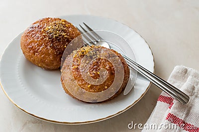 Turkish Kemalpasa Cheese Dessert / Lor Tatlisi with Pistachio Powder and Sherbet Stock Photo