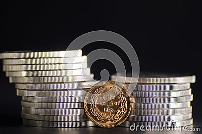 Turkish Kurush Ataturk Gold Coin in front Silver Coins Stock Photo