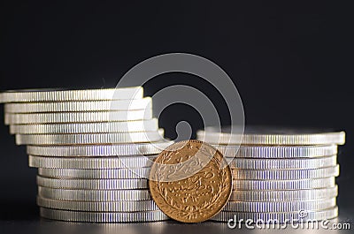 Turkish Kurush Gold Coin in front Silver Coins Stock Photo