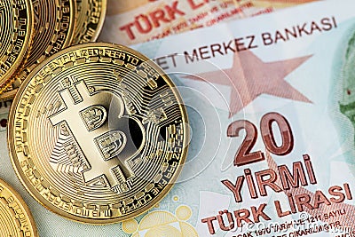 Turkish Lira currency banknotes with Bitcoin BTC cryptocurrency coins. Stock Photo